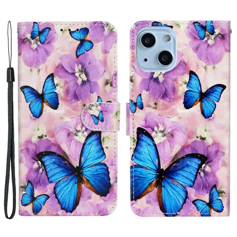 Housse iPhone 13 Mini Papillons Bleus dans les Fleurs